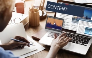 This image show the essence of a content creator at work, planning blogs, videos, and other digital media. It highlight the role of valuable, engaging content in attracting audiences and boosting SEO efforts organically